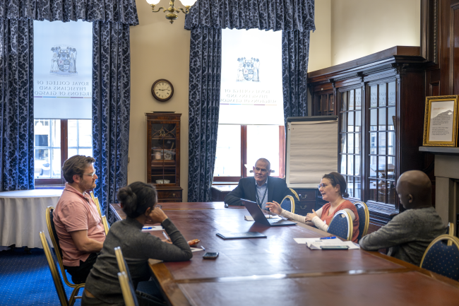 People chatting at a meeting